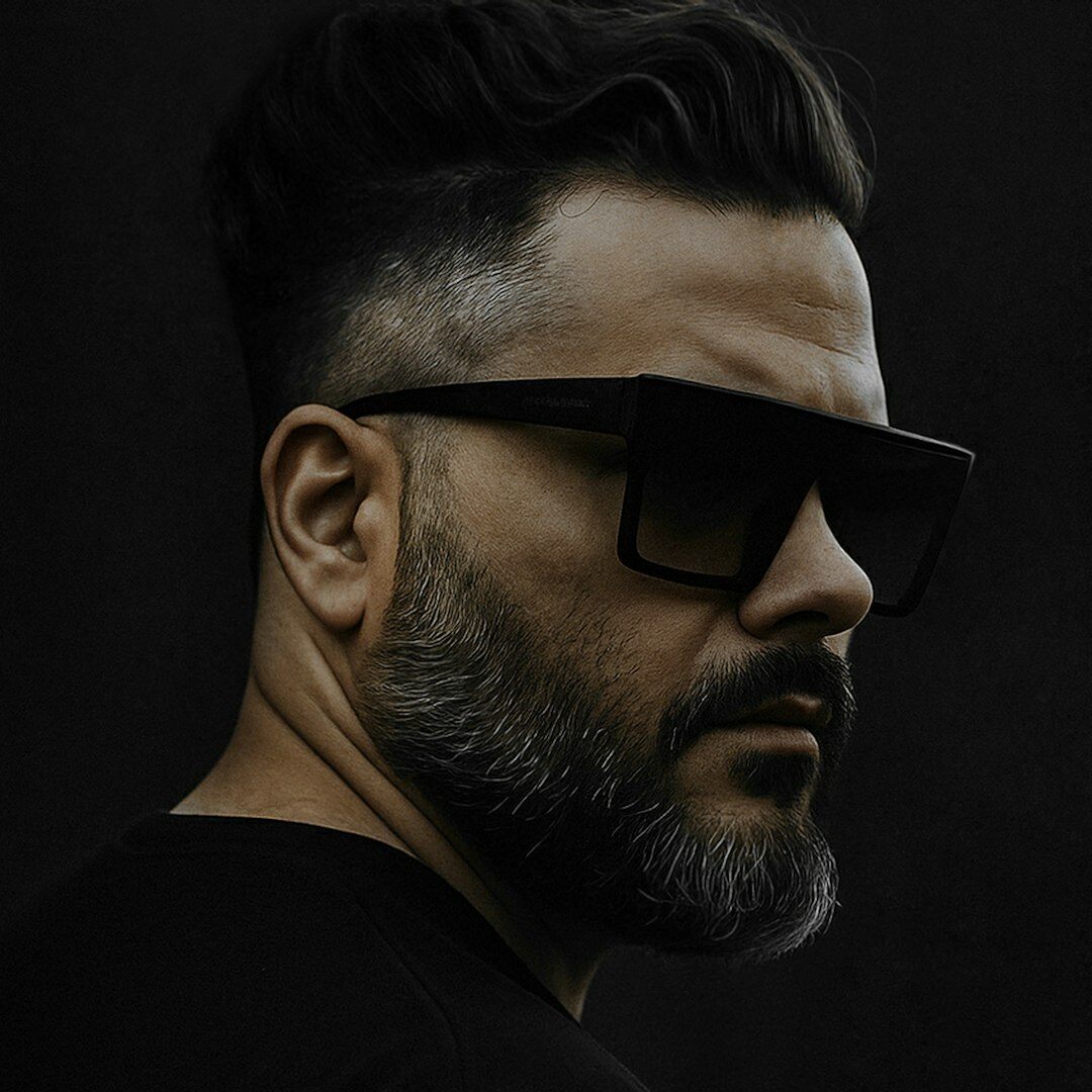 Professional portrait of a man with glasses and beard