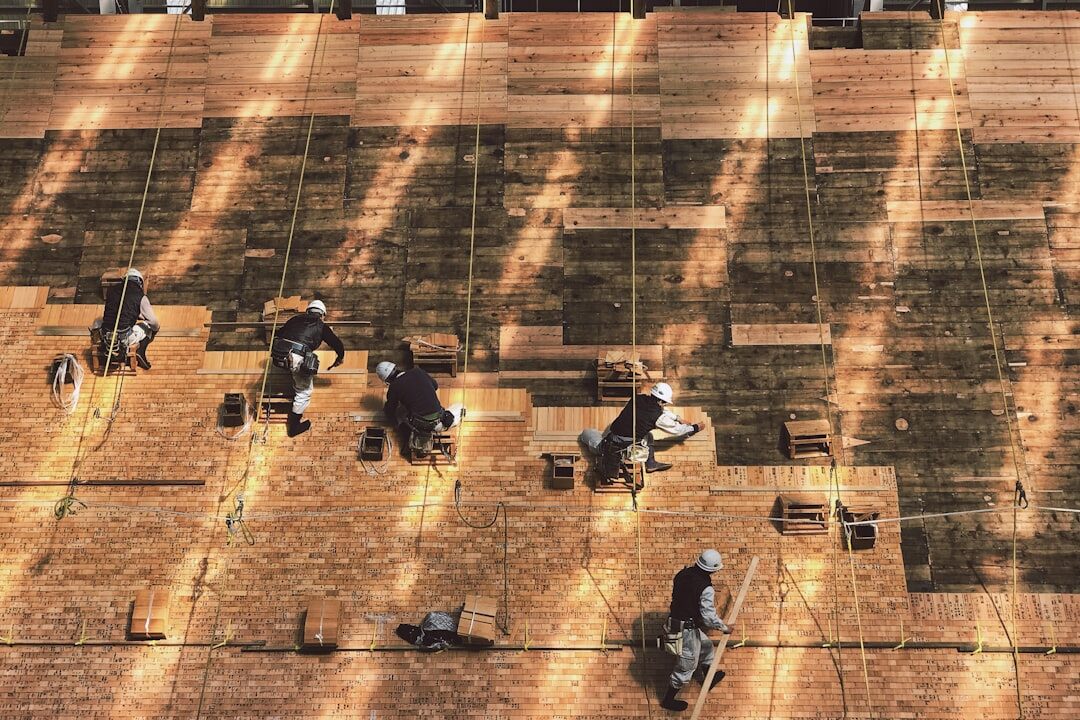 Overhead view of a workshop with people working at tables